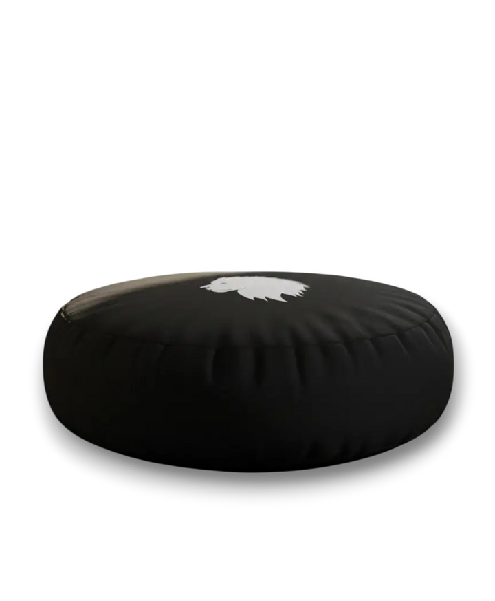 Black meditation cushion with a white lion head logo on a white background