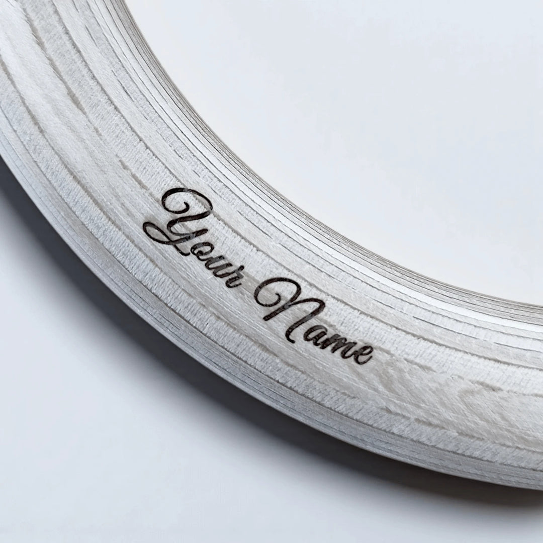 Wooden gymnastic ring with perosnalized name engraving.