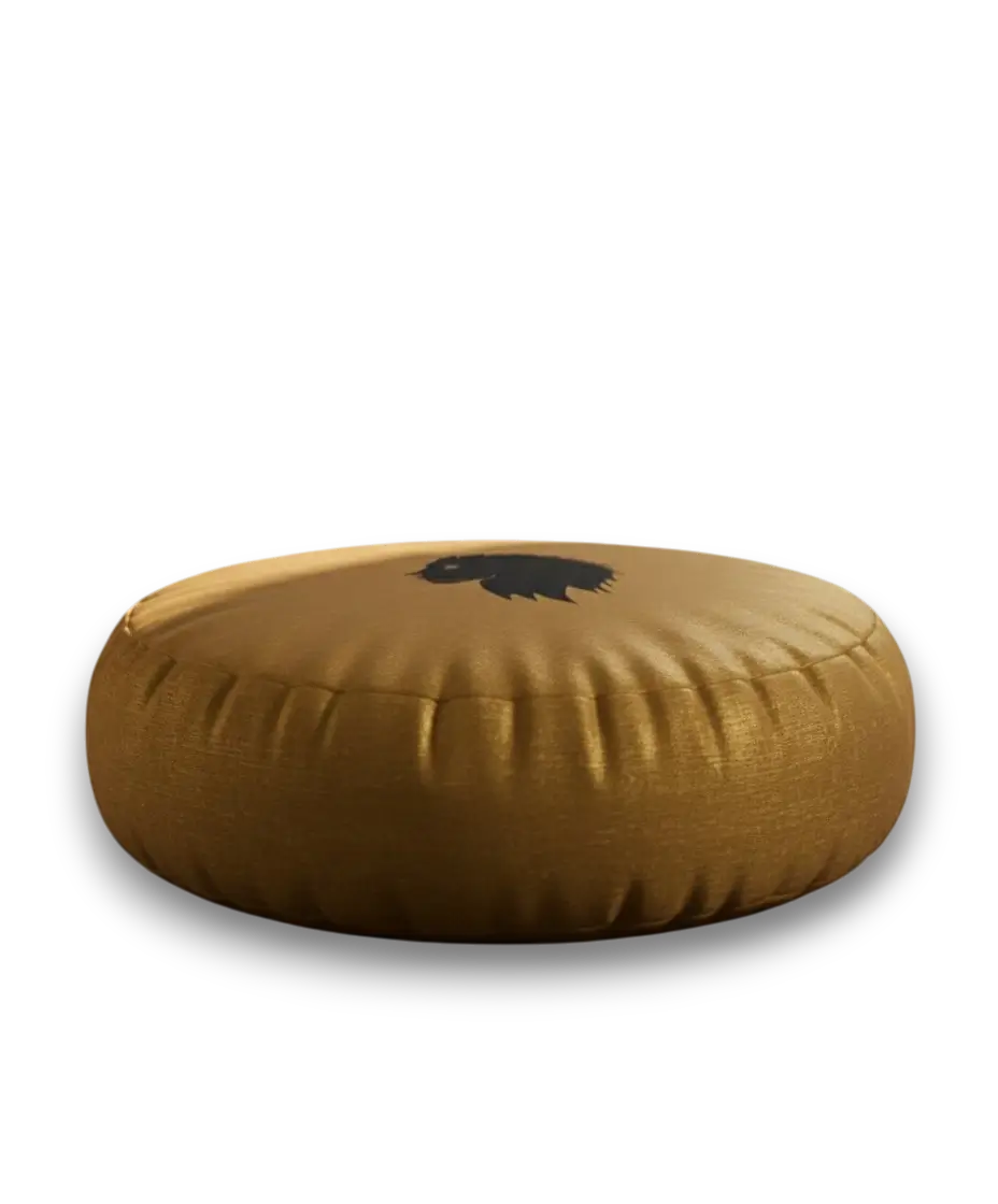 Round golden meditation cushion with a black design and black lion head