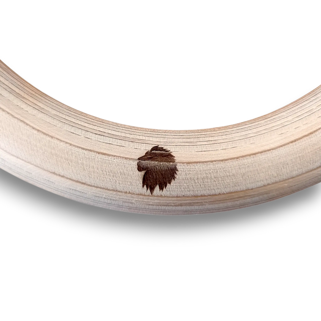 Wooden gymnastic ring with a lion engraving