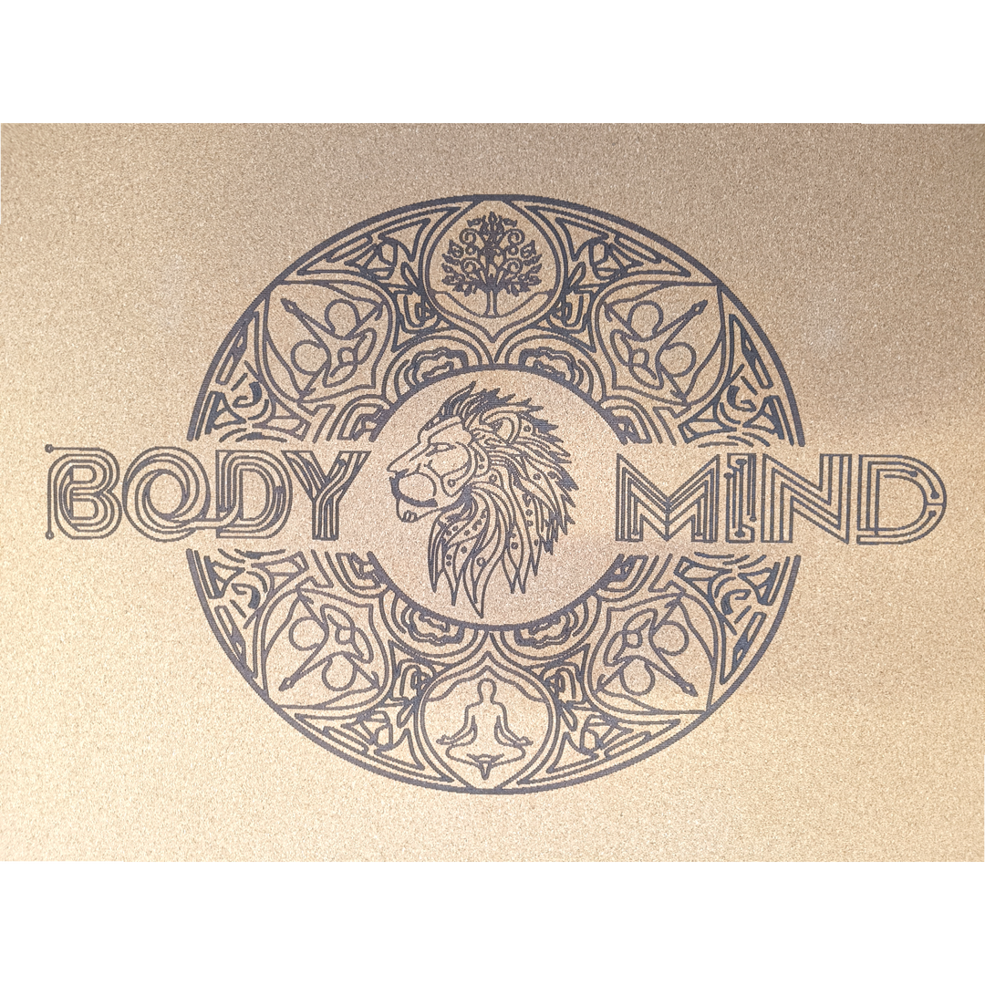 Decorative lion symbol design on a yoga cork mat surface with abstract patterns and text.