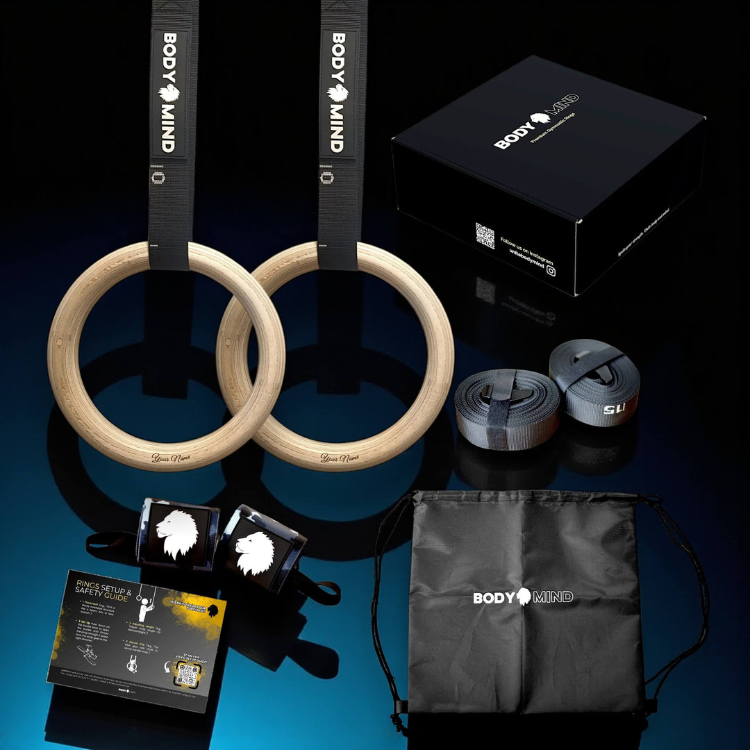 Collection of fitness equipment including custom name wooden rings, straps, and a bag.