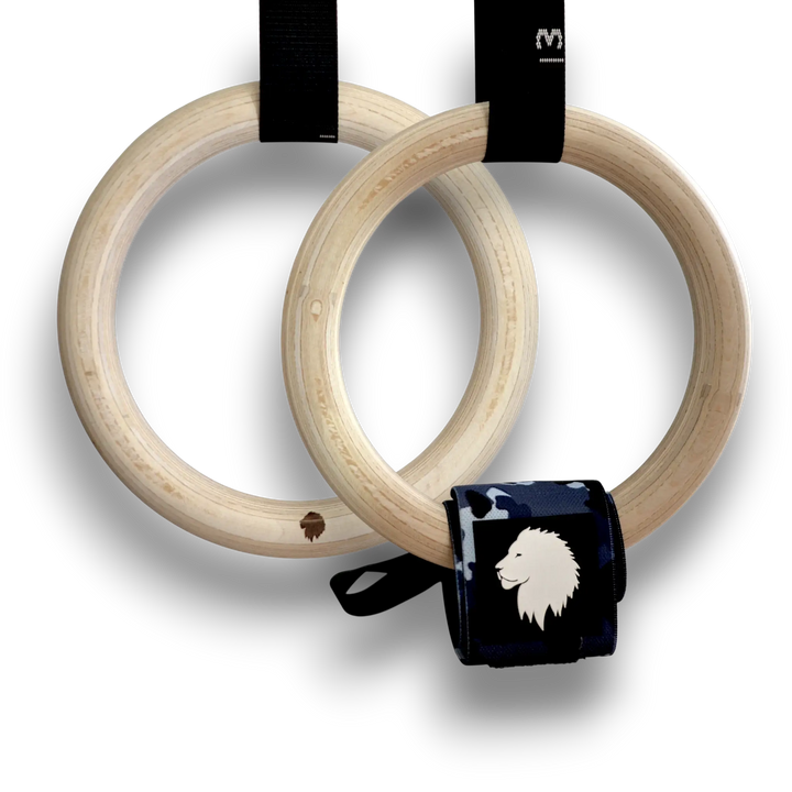 Wooden gymnastic rings with black straps on a white background