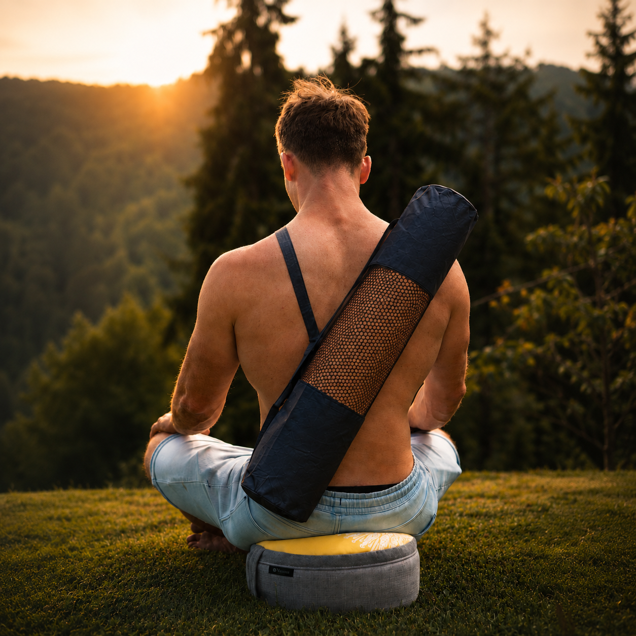 Man sitting outdoors with a yoga mat over his shoulder, surrounded by nature.